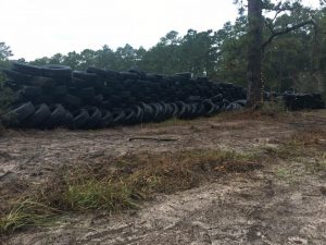 stacked tires as foundation for berm walls at range