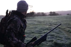 Hunter in dark camoflage
